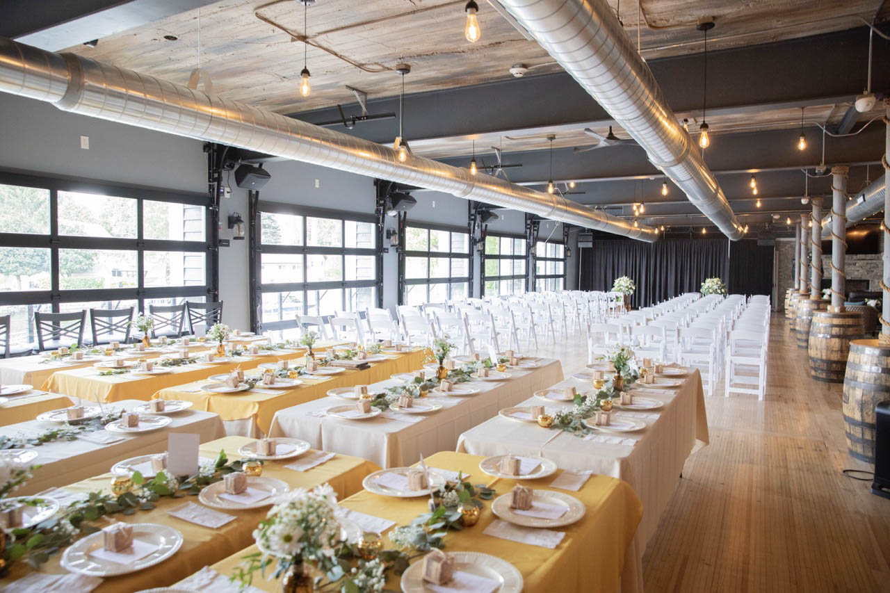 Event at Below Deck with the glass garage doors open to Okauchee Lake